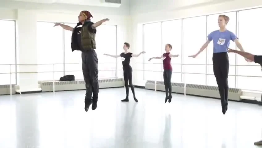 Lucas dancing in ballet class with other dancers