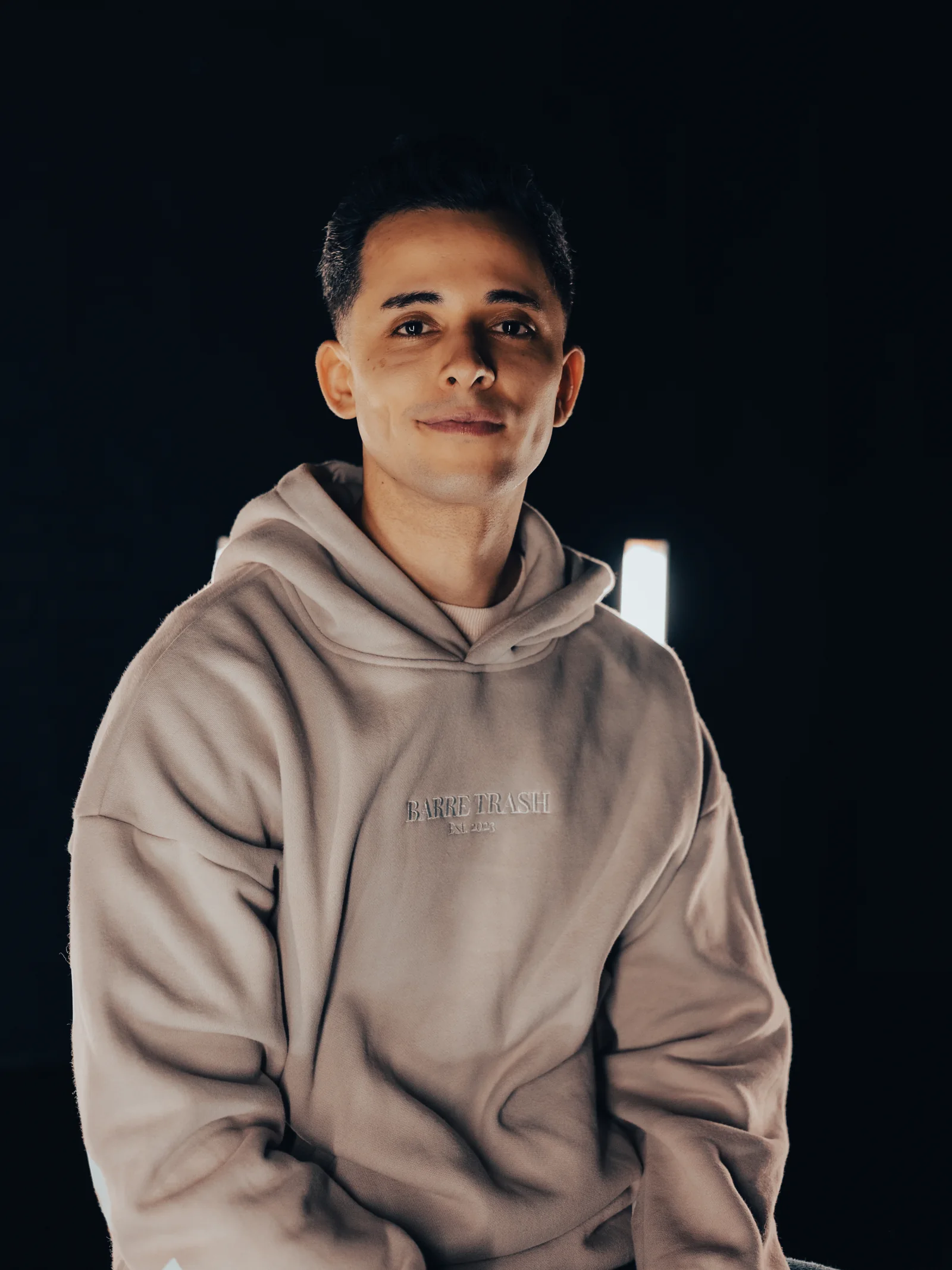 Lucas Labrador in a Barre Trash hoodie