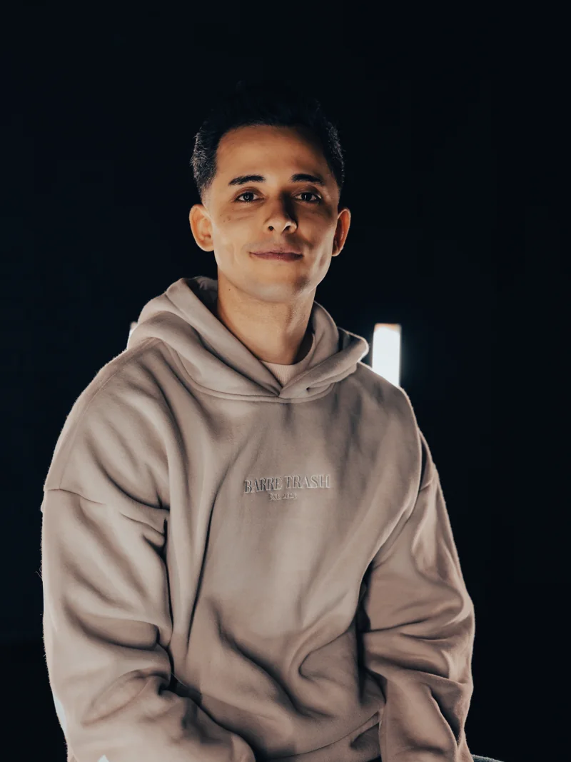 Lucas Labrador wearing a Barre Trash hoodie