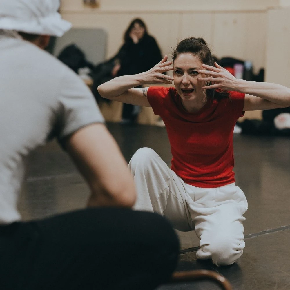 Melody Mennite working with dancers in rehearsal for The Wolff